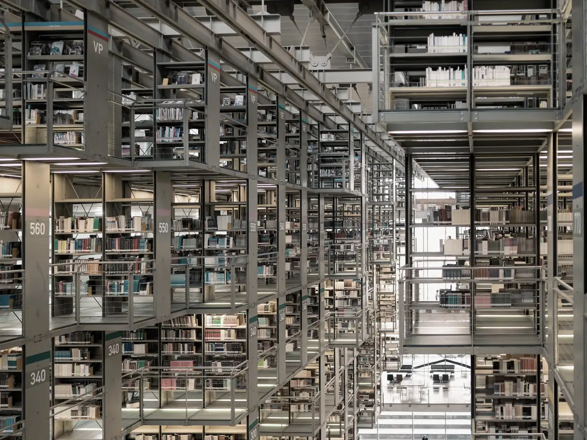 Library stacks rising through several storeys of open shelving